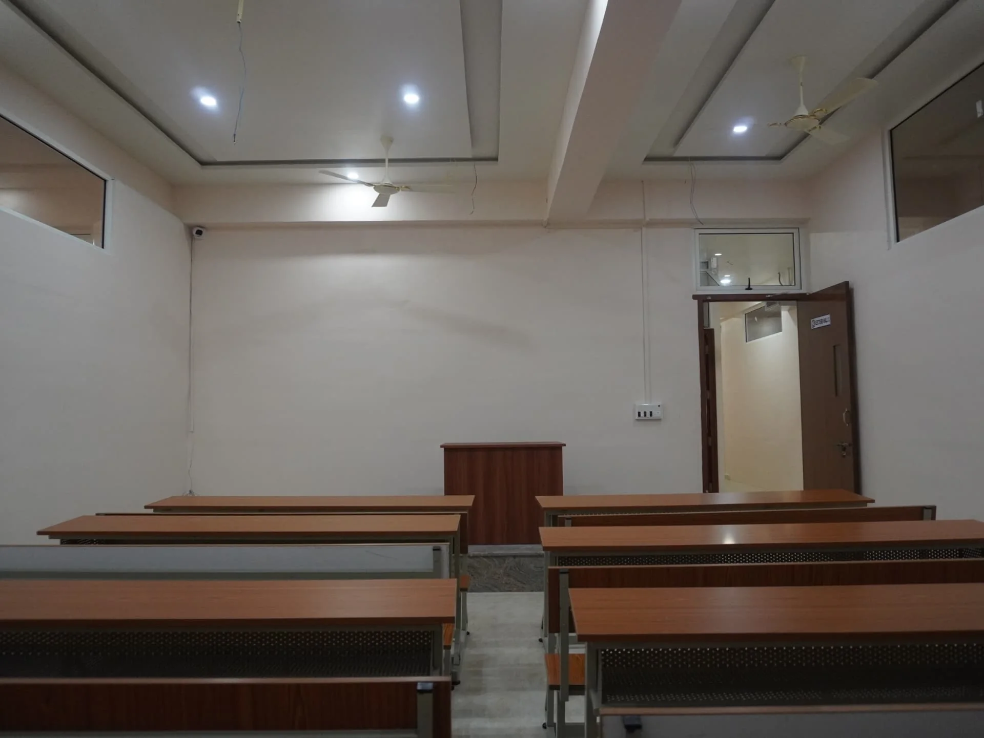 Front view of a class room with lecture desk and student seating